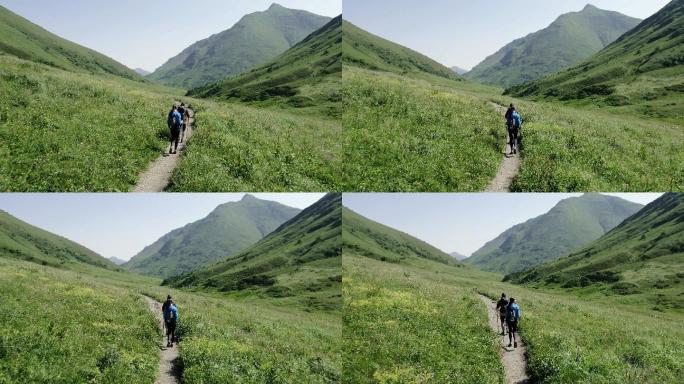 一对年轻的成年人夫妇在山上徒步旅行