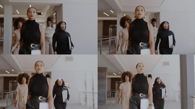 一组年轻女商人一起穿过办公楼的4k视频片段