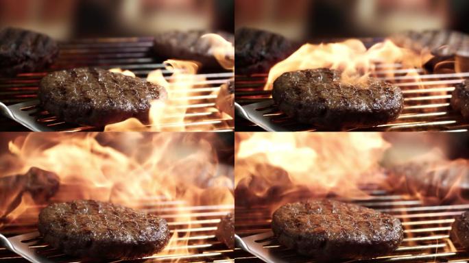 烧烤牛肉饼上的火焰超级慢镜头