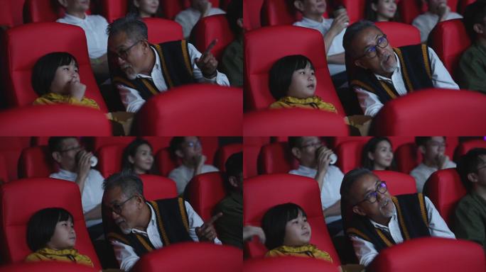 亚裔华人活跃老人和孙女喜欢在电影院看电影