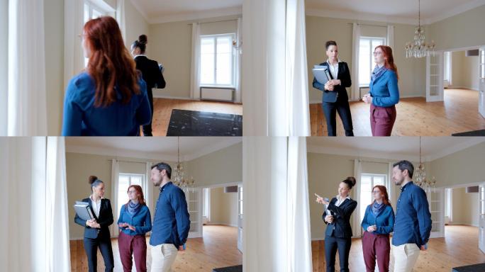 房地产经纪人向一对夫妇展示一套空公寓