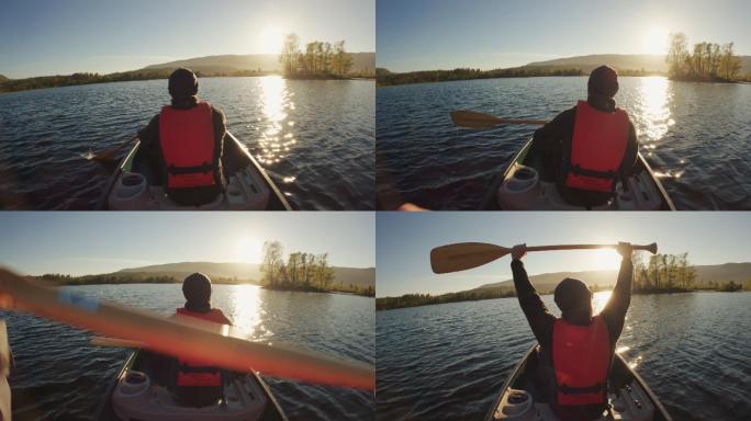 户外冒险：日落时在湖中划独木舟