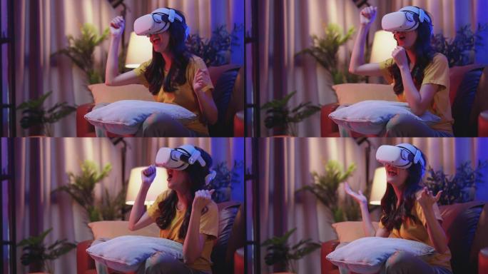 年轻迷人的休闲亚裔女性在家里的客厅里，通过VR眼镜、耳机、护目镜，在沙发上观看虚拟现实中的表演生活流