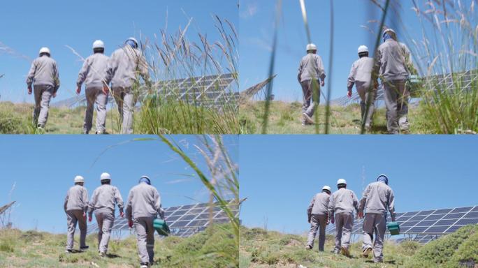 烈日三名工作人员走向太阳能发电板维护检修