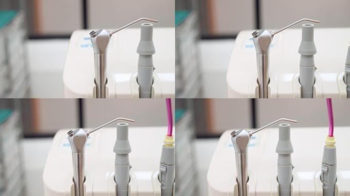 摇摄和特写：牙科单元带有唾液喷射器的空气吸入系统，为牙医在医院补牙做准备