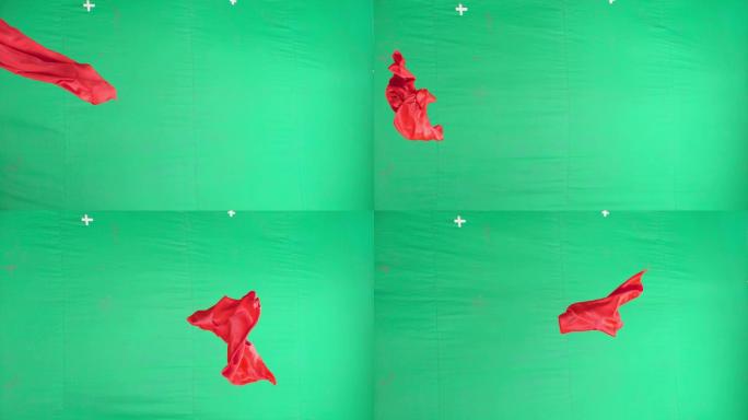 红色绸缎在绿幕前随风飘扬一组镜头
