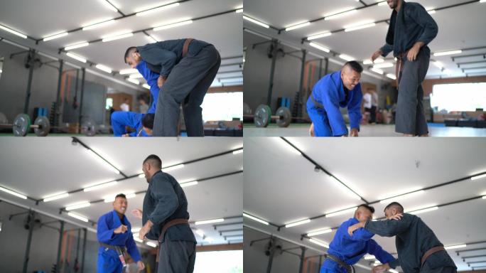 两名男子柔道练习者在体育馆内打斗