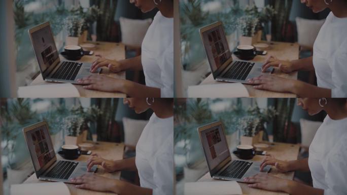 一名年轻女子在咖啡馆使用笔记本电脑的4k视频片段