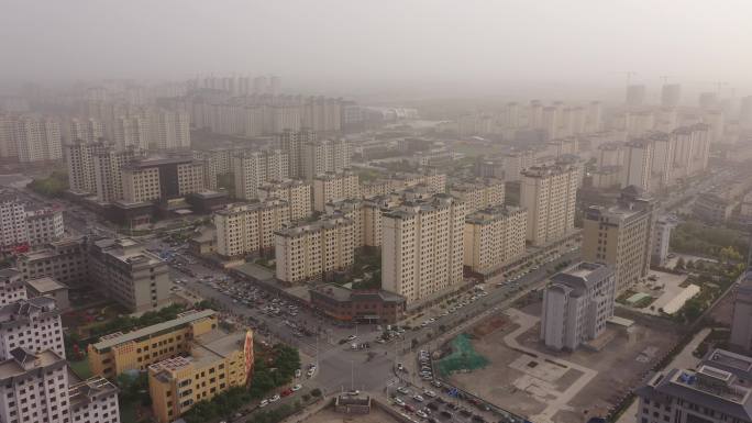 俯拍城市挟沙雾霾天