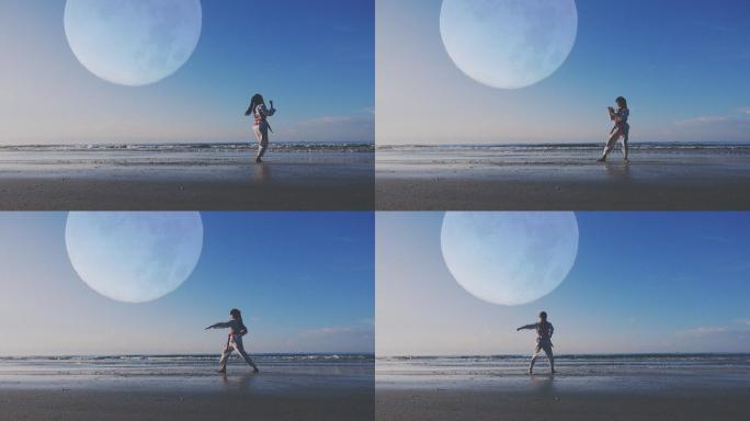4k：以满月为背景，年轻女子在海滩上户外练武