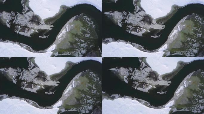 冰封的冬日河湖上的春冰漂流飞越龙头形状-无人机收藏库存视频