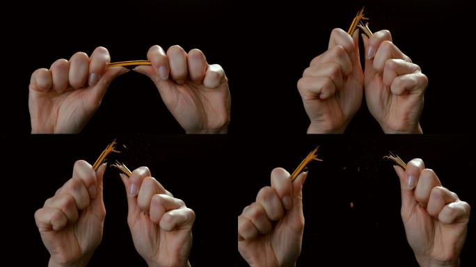 SLO MO LD女性双手将铅笔掰成两半
