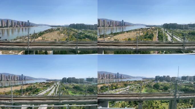中国福建高铁穿过城市高架桥，窗外是城市景观
