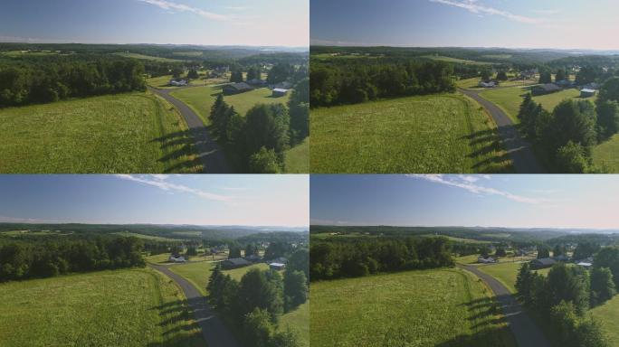 宾夕法尼亚州门罗县波科诺斯风景鸟瞰图。阳光明媚的夏日早晨。从田野和森林到Kunkletown，再到路