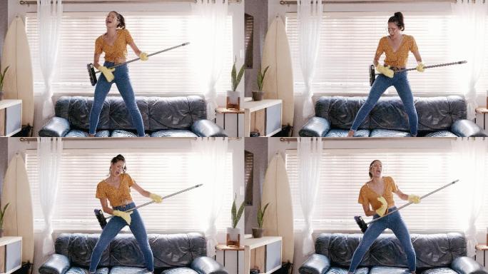 一名年轻女子在打扫休息室的同时，休息一下，尽情跳舞的4k视频片段