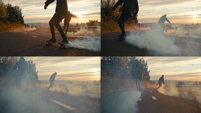 中景：年轻人在日落大道上玩着烟雾弹滑板