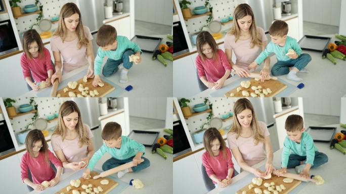制作饼干的年轻家庭。