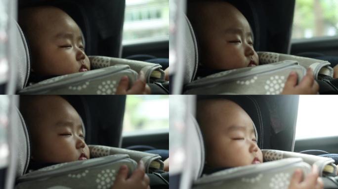 在车里睡着的亚洲男婴