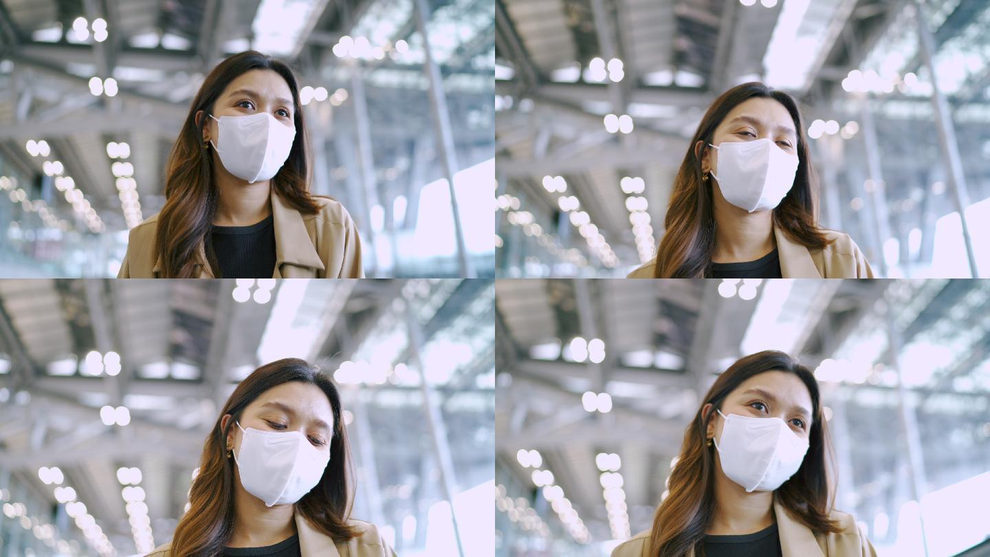 在国际机场戴着防护面具的女旅行者。