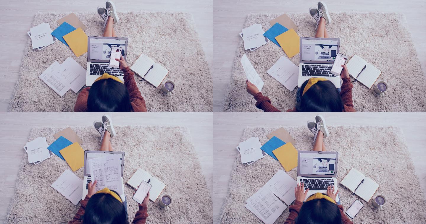 从上方拍摄的一段4k视频，一个面目全非的女孩在家的地板上完成文书工作