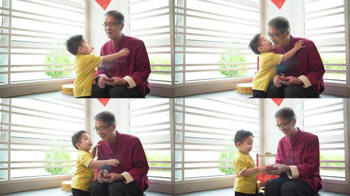 中国农历新年期间，一名亚裔中国孙子在客厅拥抱祖父