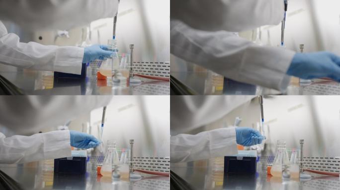 科学家在实验室用吸管取样