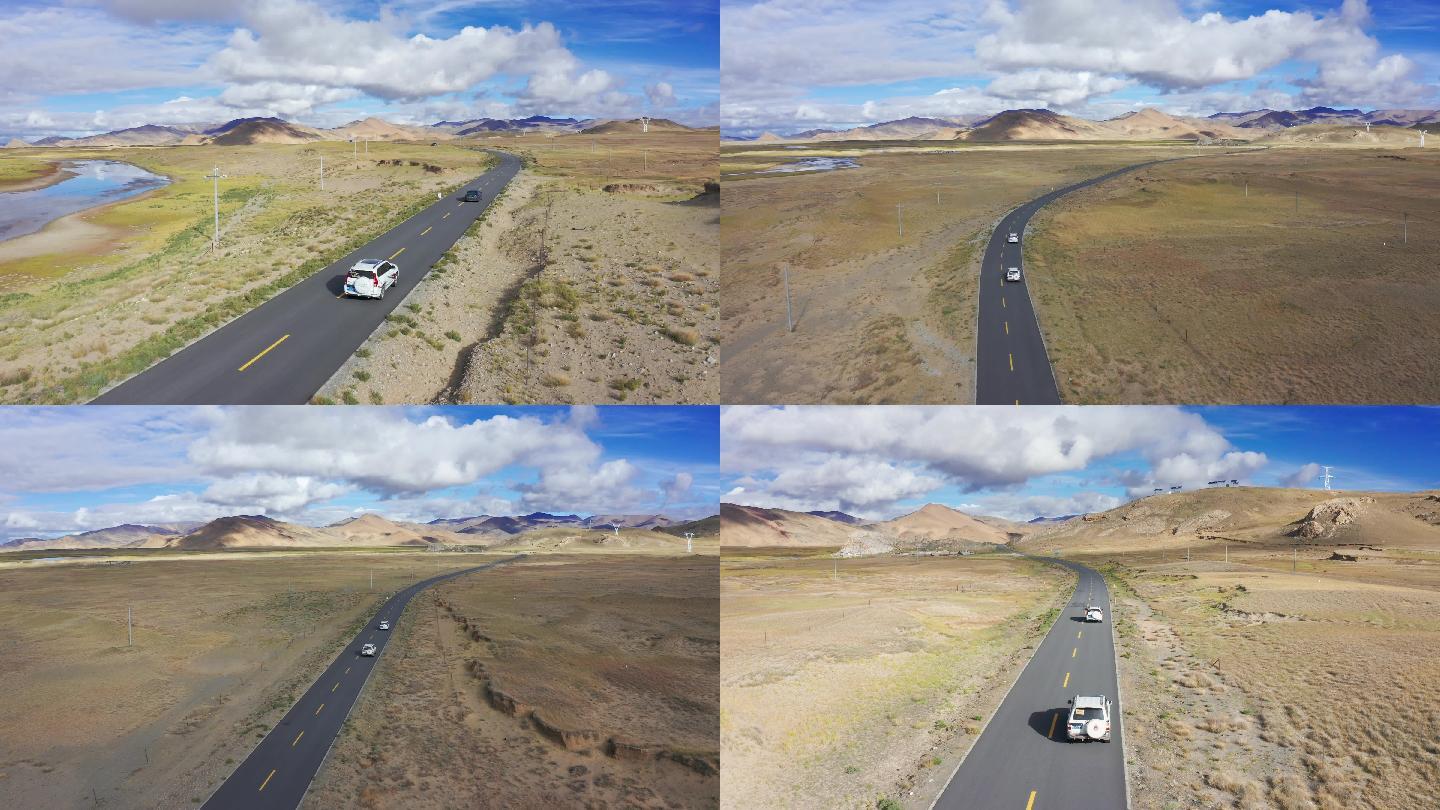 航拍汽车行驶在西藏219国道上