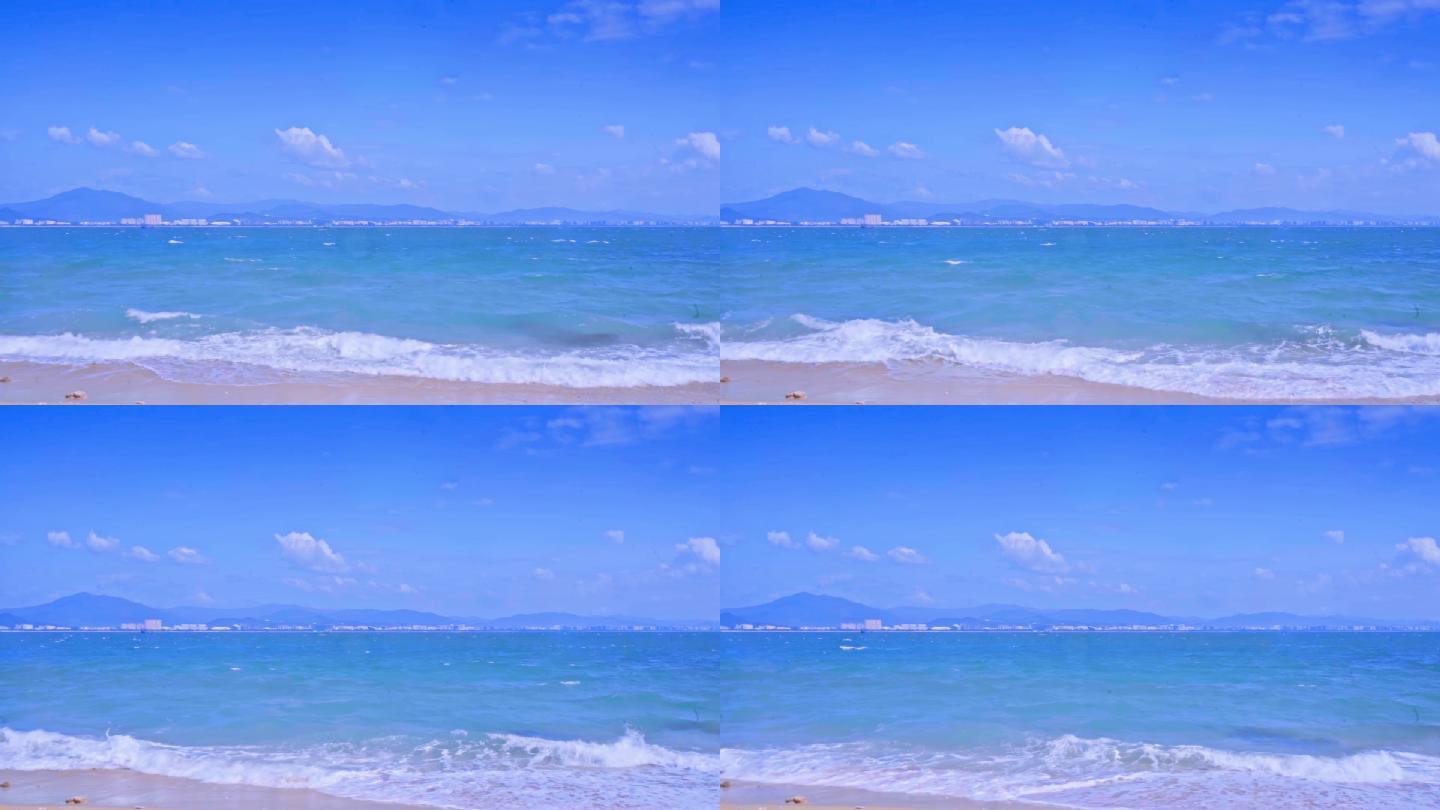 海南三亚蓝天沙滩海浪海边玻璃海升格度假