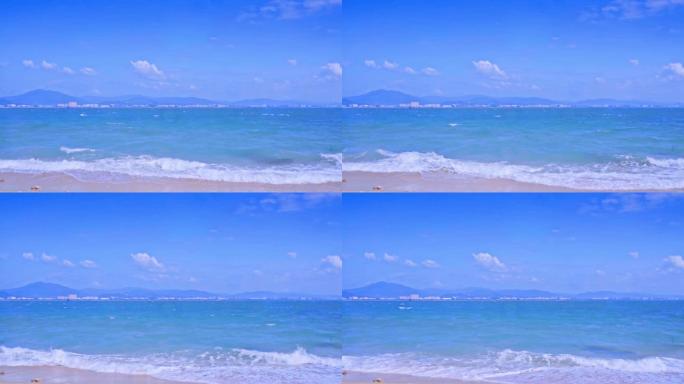 海南三亚蓝天沙滩海浪海边玻璃海升格度假