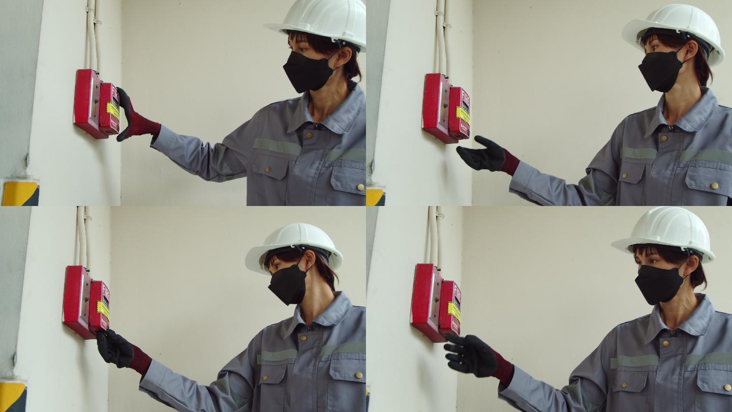 亚洲女技师检查员检查建筑物内的泄漏状态火灾警报。女工程师