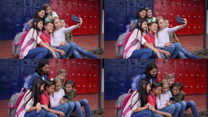 拉丁美洲校友在学校休息时间用智能手机自拍
