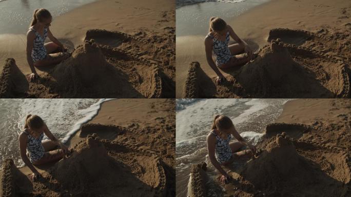 少女在海滩上建造沙堡