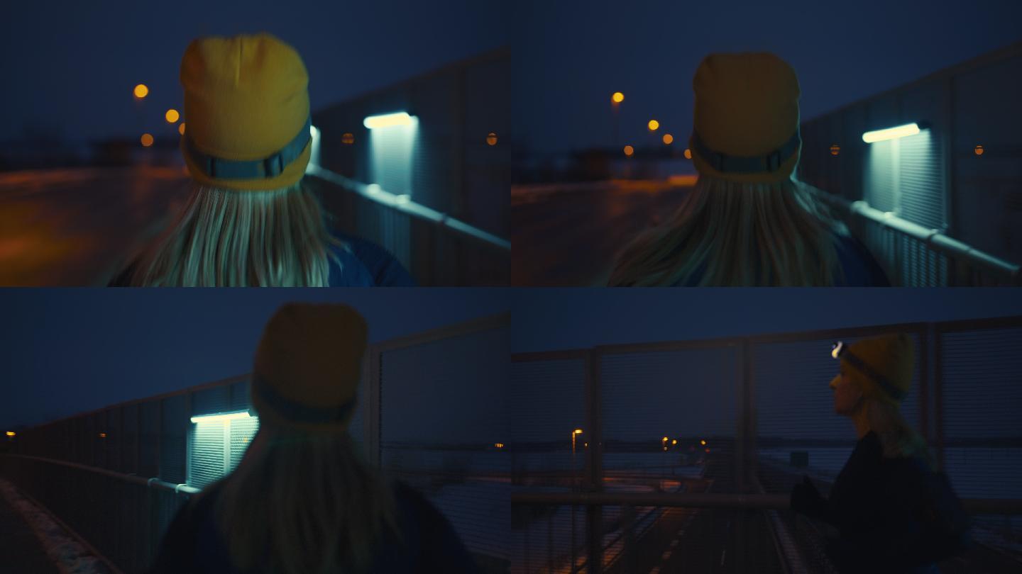 斯洛-莫（SLO-MO）女子夜间慢跑过桥
