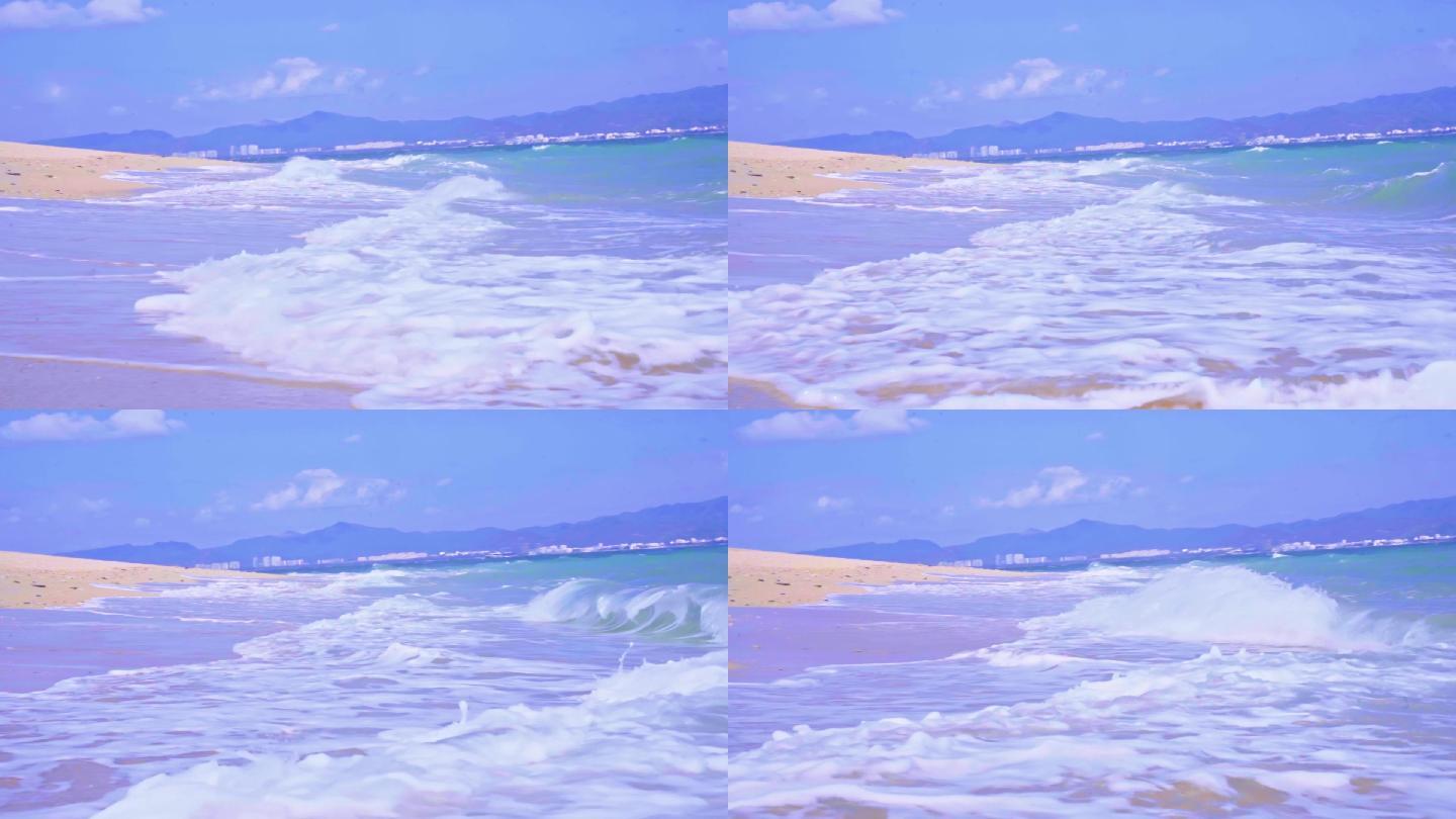海南三亚蓝天沙滩海浪边浪花玻璃海升格度假