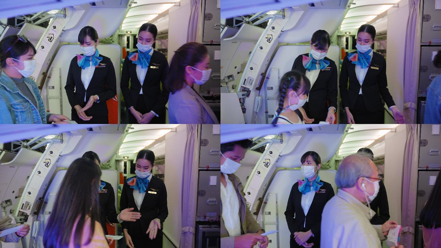 两名戴着防护面罩的亚洲空姐站在那里，戴着面罩微笑，热烈欢迎登上机场的乘客踏上2019冠状病毒疾病大流
