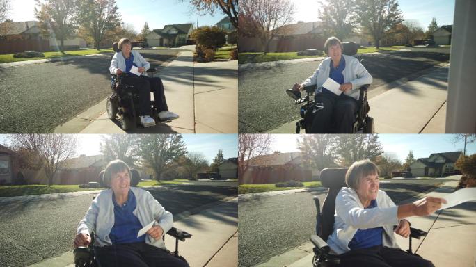 轮椅上的成年残疾女性往返邻里邮箱4K视频系列