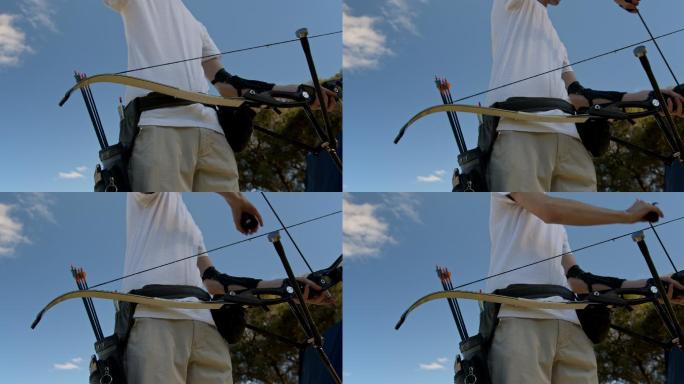 一名弓箭手将箭射入弓中的4k视频片段