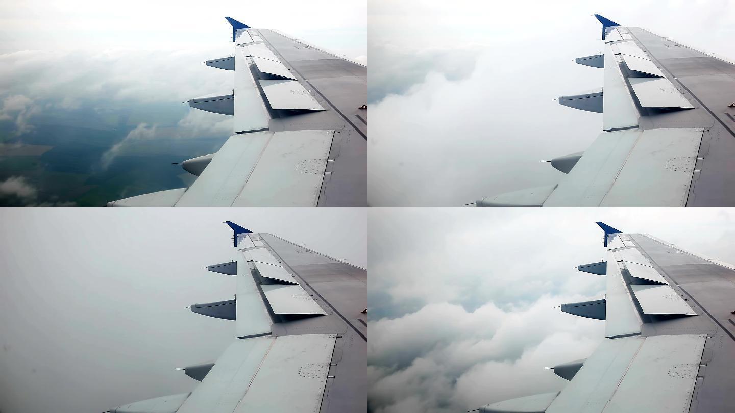 云中飞行的飞机机翼