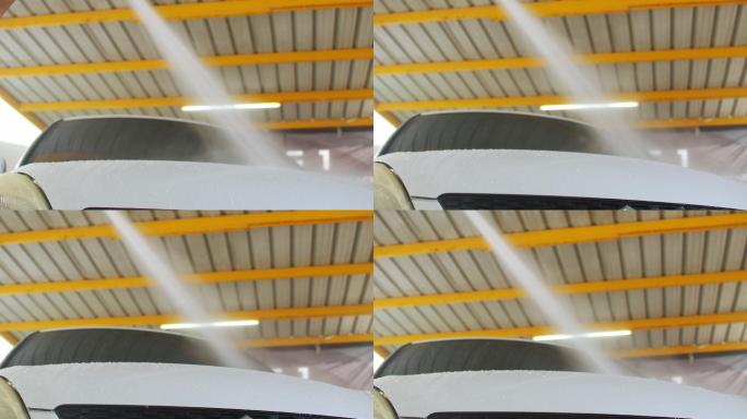 亚洲员工洗车为客户服务。