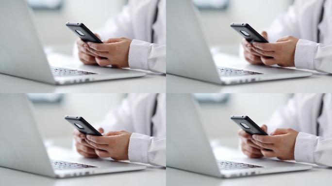 年轻女医生在办公室使用手机