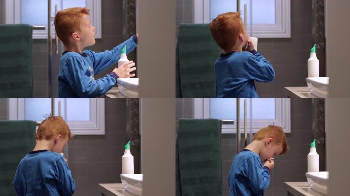 小红发男孩用盐水鼻喷雾剂清洗和排空鼻子