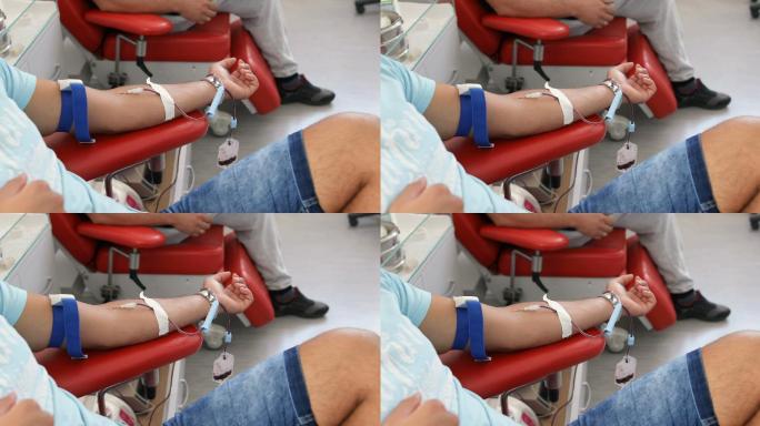 善行。为你的身体献血的好处。接受输血者的手。临床献血者的特写镜头