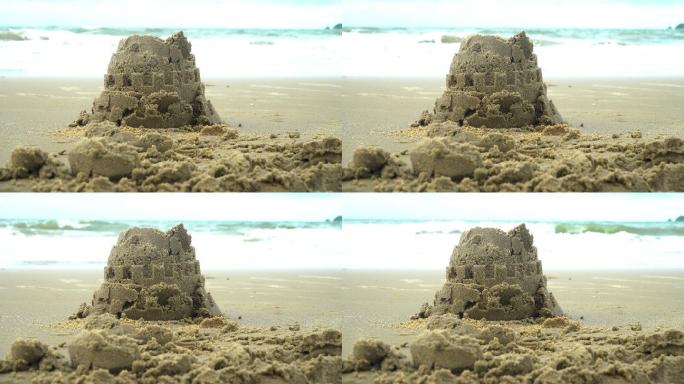 沙滩上的沙堡海边海浪沙子堆砌童话