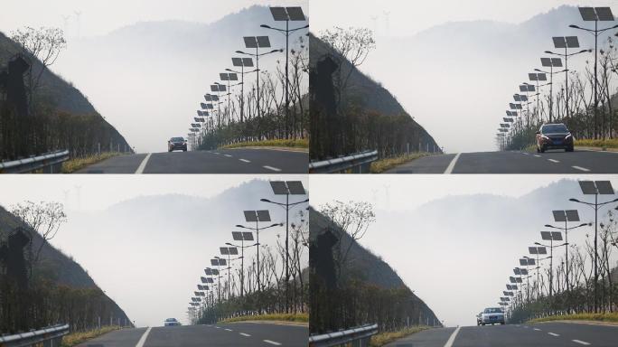 山区道路新能源太阳能路灯整齐云雾晨雾车辆