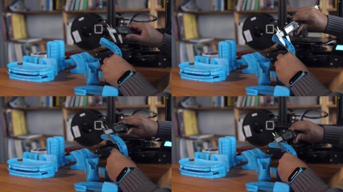 工人使用游标卡尺测量3D打印零件的比例