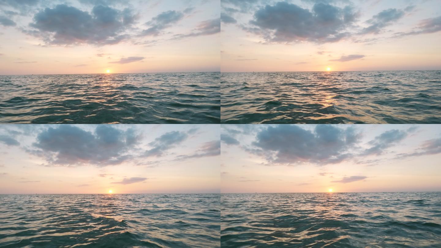 海上的日落。天际线波光粼粼