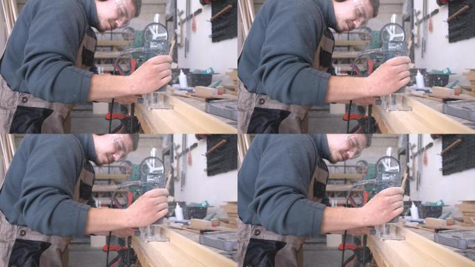 木工用手摇磨床在木板上工作