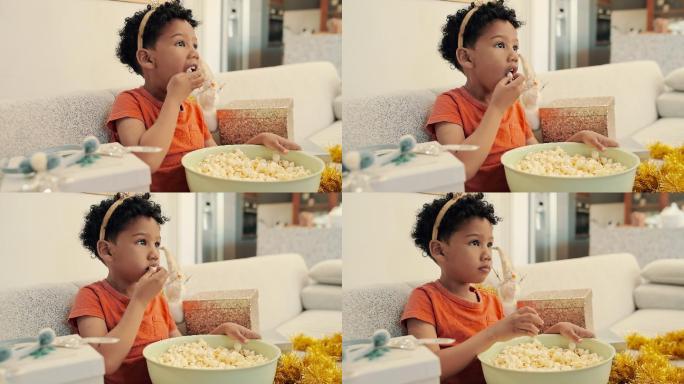 一个小男孩在家吃爆米花庆祝生日的4k视频片段