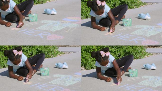 小女孩在人行道上用粉笔画画，支持医护人员