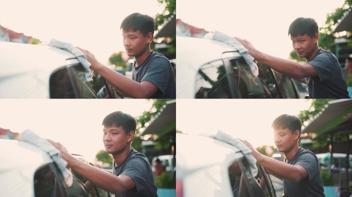 日落时分亚洲男子在家洗车